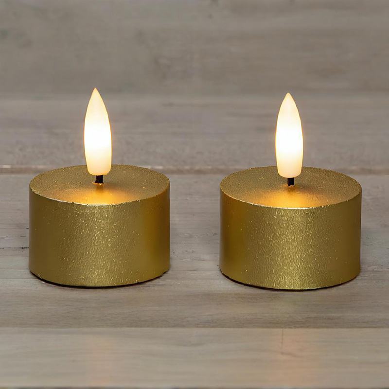 Set med 2 gyllene flamlösa värmeljus
