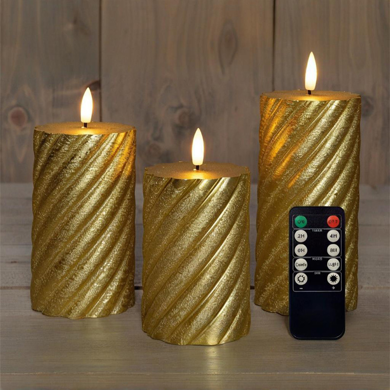 Set med 3 gyllene spiral LED-pelarljus